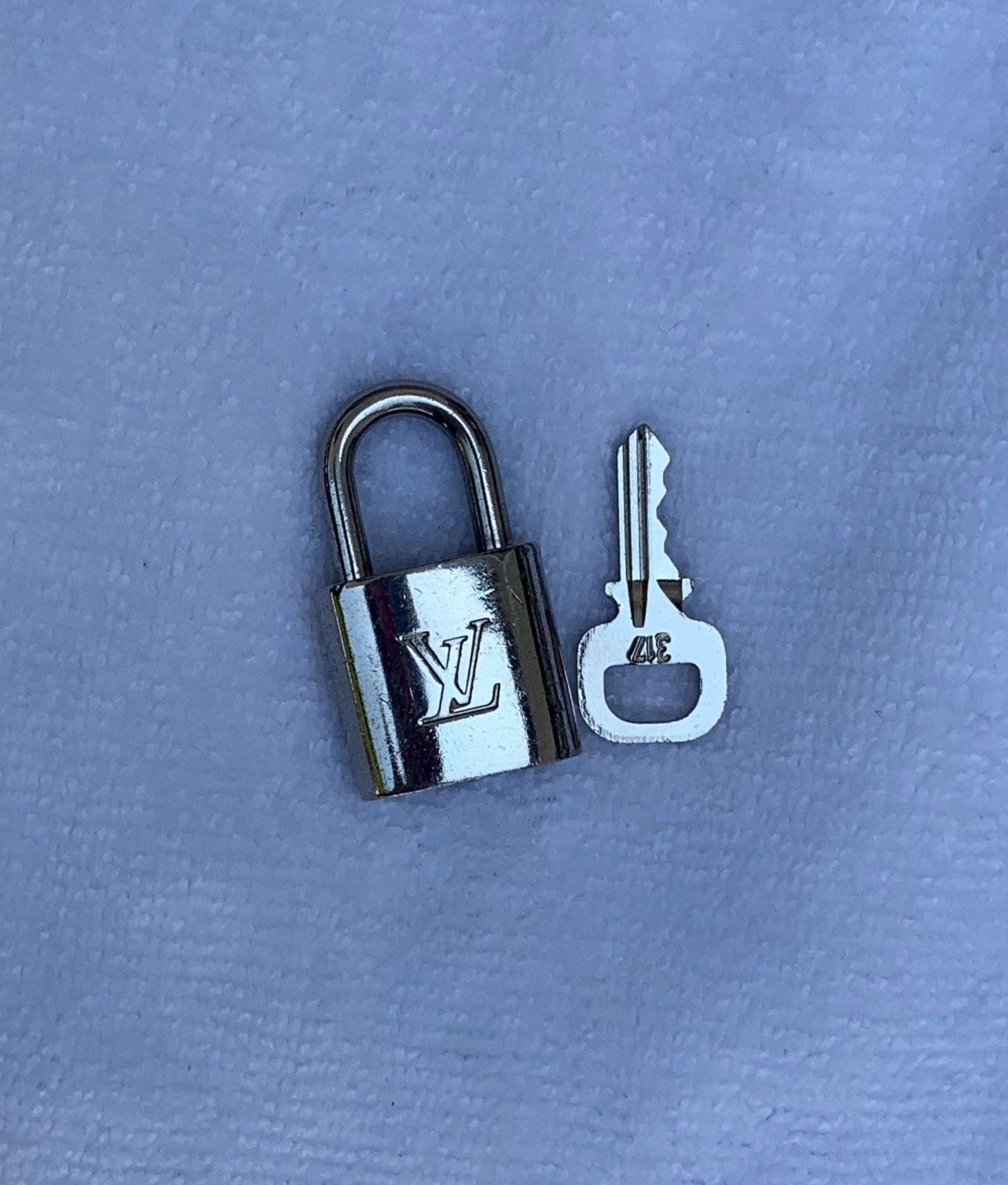 Authentic LV Silver Lock and Key Set Accessory – Haus of Luxury